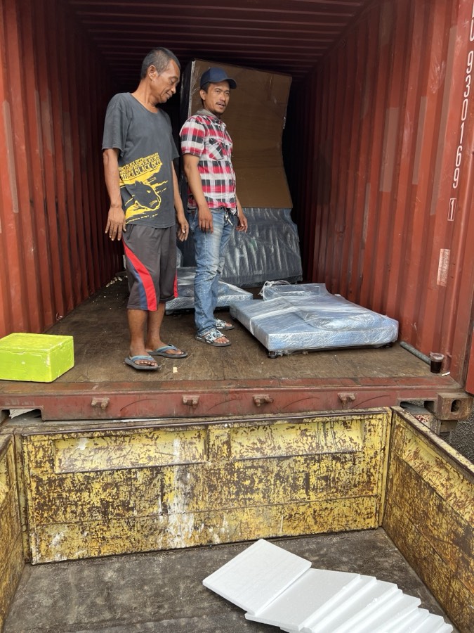 A cabinet still crated on arrival